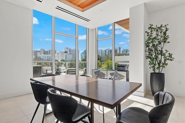 1335 2nd St Unit 301, Sarasota, FL 34236 - dining space featuring a city view, light tile patterned floors, and floor to ceiling windows