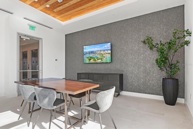 dining area featuring french doors and wood ceiling