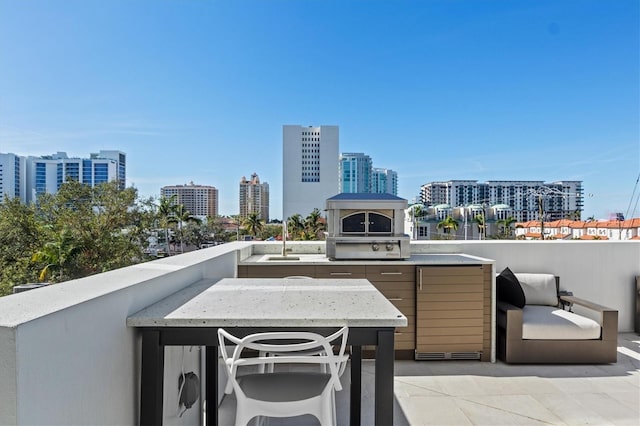 1335 2nd St Unit 301, Sarasota, FL 34236 - view of patio featuring a view of city and an outdoor kitchen