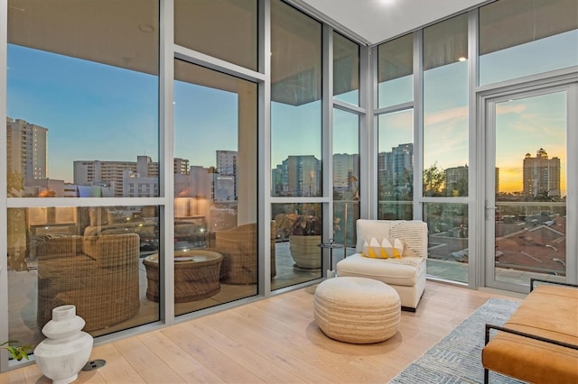 1335 2nd St Unit 301, Sarasota, FL 34236 - living area with expansive windows, a view of skyline, and wood finished floors