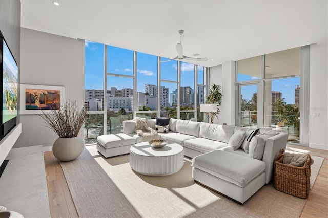 1335 2nd St Unit 301, Sarasota, FL 34236 - living area featuring a view of skyline, wood finished floors, floor to ceiling windows, ceiling fan, and recessed lighting
