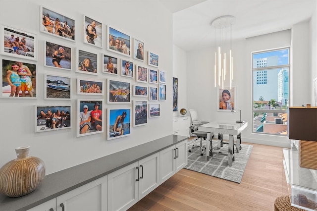 1335 2nd St Unit 301, Sarasota, FL 34236 - dining area featuring light wood finished floors