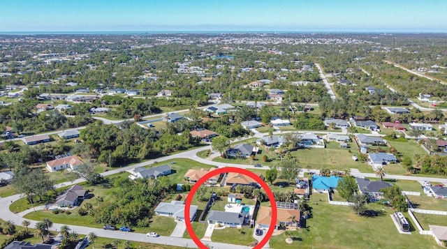 birds eye view of property with a residential view