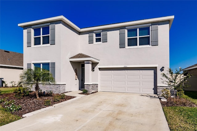 view of front of property with a garage