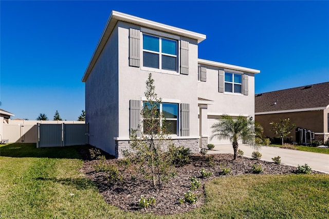 view of front of property with a front yard and a garage