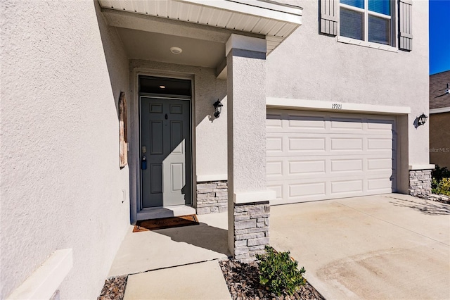 entrance to property featuring a garage