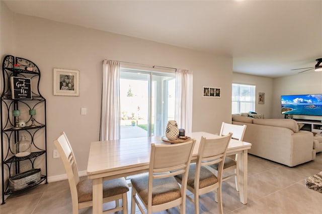 dining space featuring plenty of natural light, ceiling fan, and light tile patterned floors