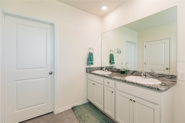 bathroom with tile patterned flooring and vanity