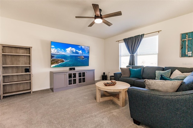 living room with light carpet and ceiling fan