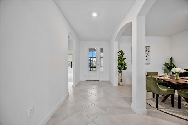 foyer entrance with light tile patterned flooring