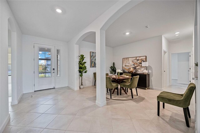 entryway with light tile patterned floors