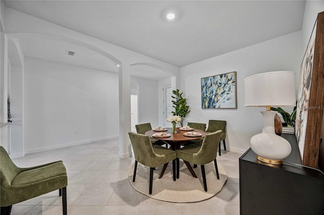 dining space with light tile patterned floors