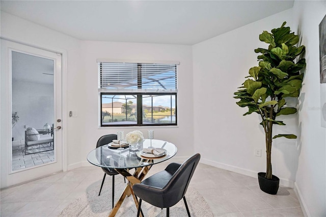 dining space with light tile patterned flooring