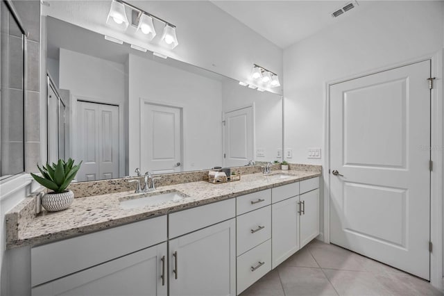 bathroom with vanity and tile patterned floors