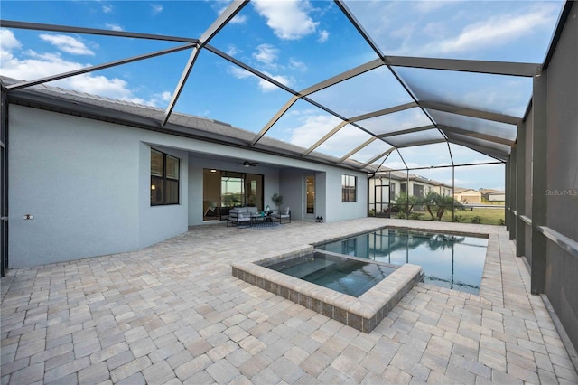 view of swimming pool with an in ground hot tub, a lanai, an outdoor living space, ceiling fan, and a patio