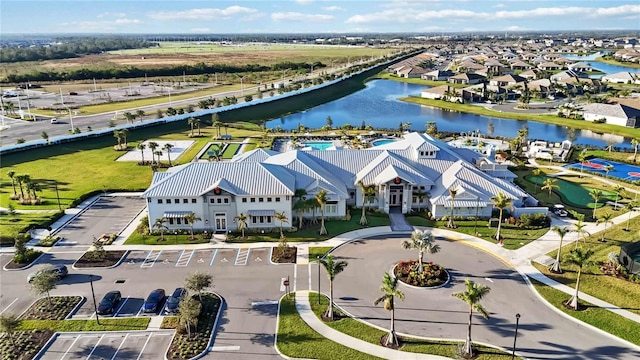 birds eye view of property with a water view