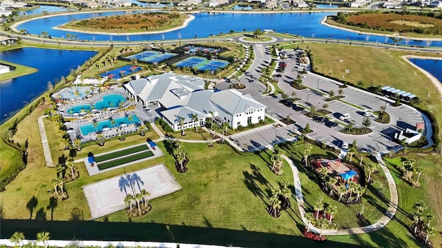 birds eye view of property with a water view