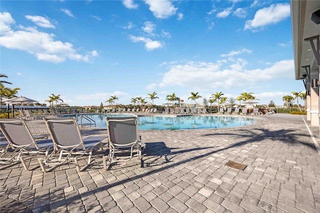 view of pool with a water view