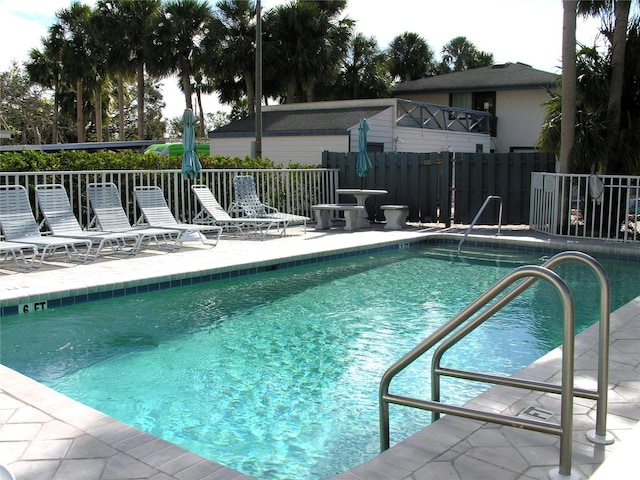 view of swimming pool featuring a patio