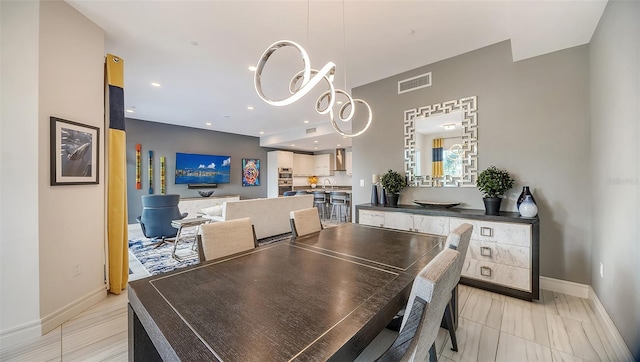 dining space featuring a notable chandelier