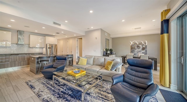 living room featuring an inviting chandelier