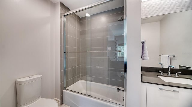 full bathroom featuring vanity, toilet, and enclosed tub / shower combo