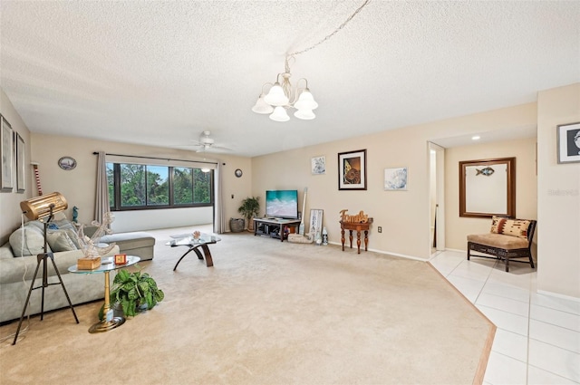 living room featuring a textured ceiling, ceiling fan with notable chandelier, and light carpet