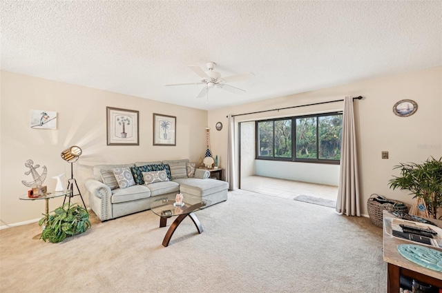 carpeted living room featuring a textured ceiling and ceiling fan