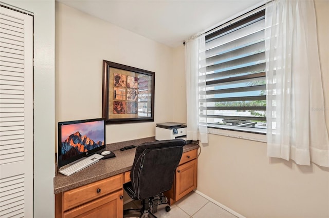 office space with light tile patterned floors