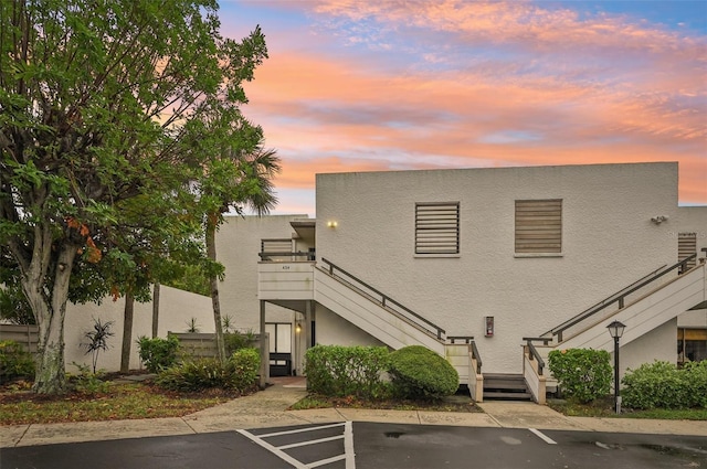 view of outdoor building at dusk