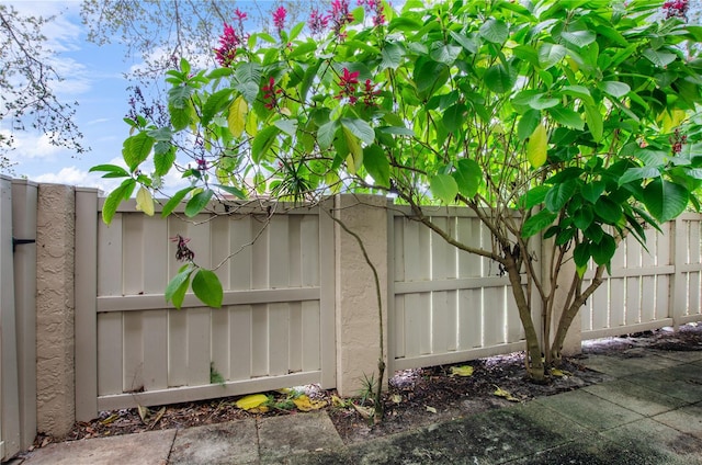 view of gate with fence