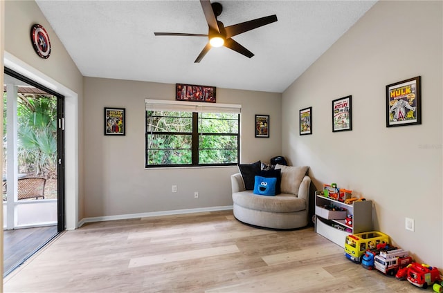 3415 51st Avenue Cir W Unit 206, Bradenton, FL 34210 - living area with wood finished floors, a ceiling fan, vaulted ceiling, and a textured ceiling