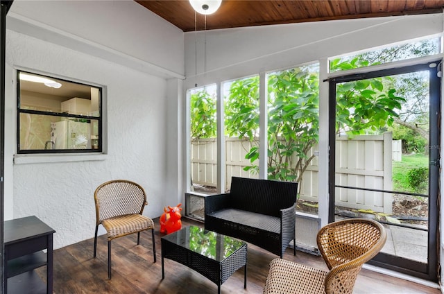 3415 51st Avenue Cir W Unit 206, Bradenton, FL 34210 - sunroom with wood finished floors, plenty of natural light, a textured wall, vaulted ceiling, and wood ceiling