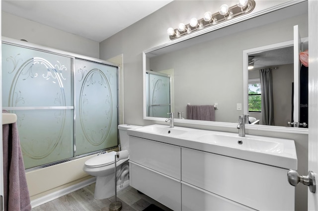 3415 51st Avenue Cir W Unit 206, Bradenton, FL 34210 - full bath featuring double vanity, shower / bath combination with glass door, and wood finished floors