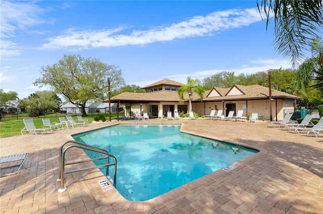 view of swimming pool featuring a patio area