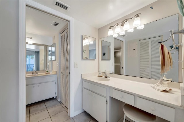 bathroom featuring tile patterned flooring and vanity