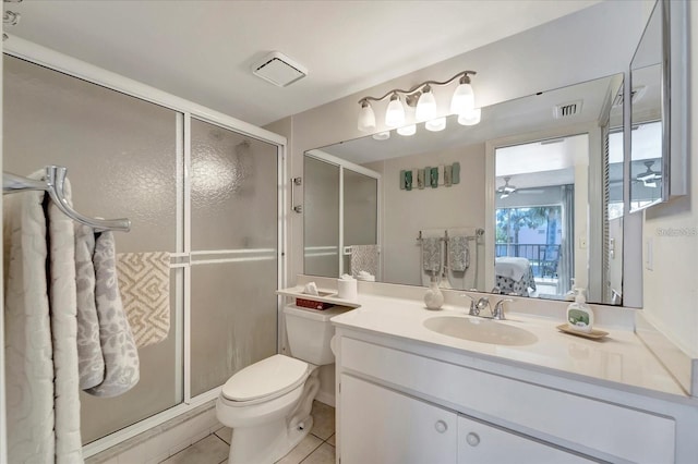 bathroom with ceiling fan, vanity, an enclosed shower, tile patterned floors, and toilet