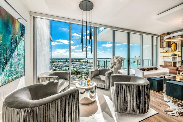 living room featuring light hardwood / wood-style flooring and floor to ceiling windows