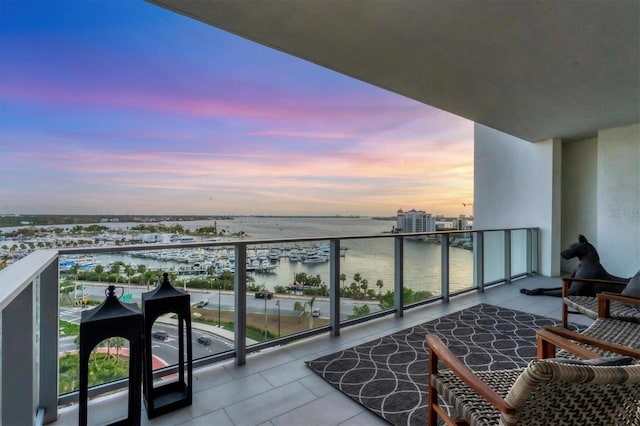 balcony at dusk with a water view