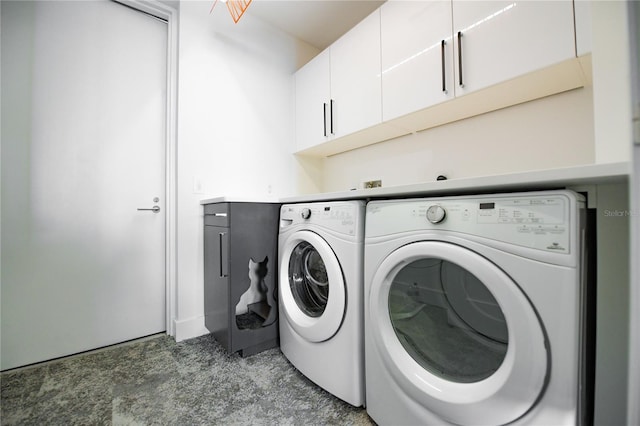 washroom with cabinets and independent washer and dryer