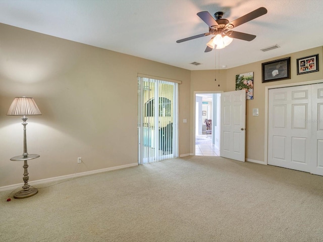 interior space with ceiling fan