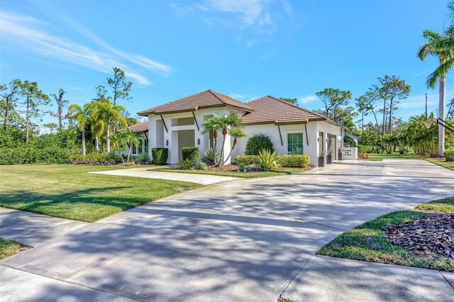 mediterranean / spanish house with a front yard