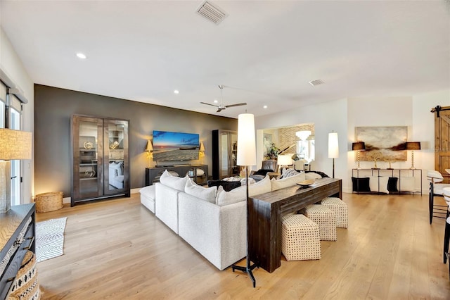 7003 River Club Blvd, Bradenton, FL 34202 - living area featuring light wood-type flooring and recessed lighting