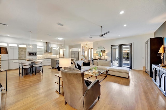 7003 River Club Blvd, Bradenton, FL 34202 - living room featuring ceiling fan, light wood-style flooring, recessed lighting, and baseboards