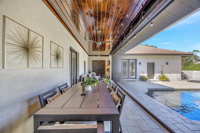 7003 River Club Blvd, Bradenton, FL 34202 - view of patio featuring outdoor dining area, an outdoor pool, and french doors