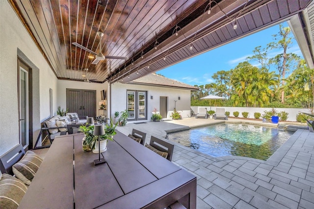 7003 River Club Blvd, Bradenton, FL 34202 - view of pool with french doors, a fenced backyard, a ceiling fan, a patio area, and outdoor dining space