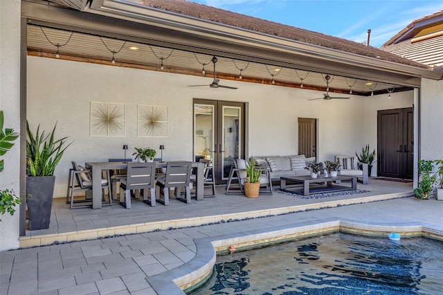 exterior space featuring an outdoor living space, ceiling fan, and french doors