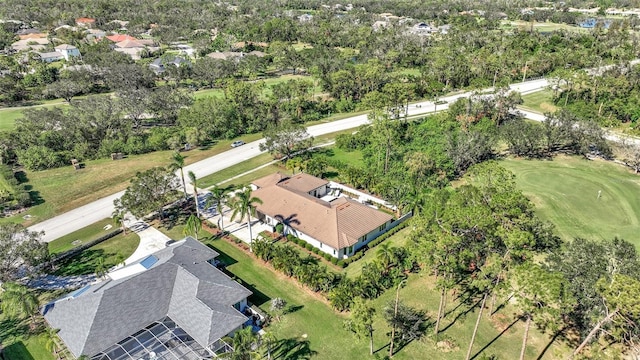 7003 River Club Blvd, Bradenton, FL 34202 - aerial view of residential area featuring a golf course and a tree filled landscape