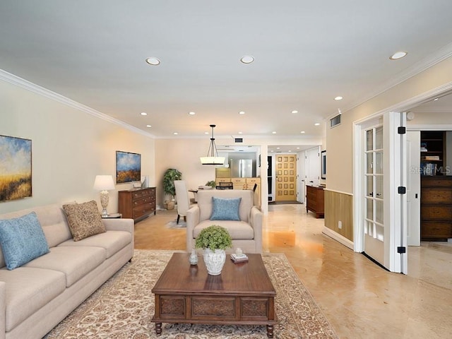 living room featuring crown molding and wooden walls