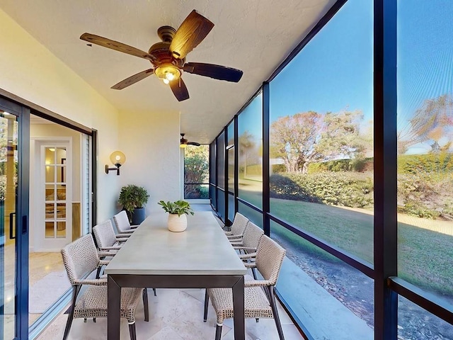 sunroom / solarium with ceiling fan and plenty of natural light